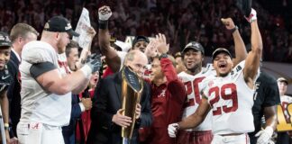 Nick Saban and Alabama players celebrate a win in 2018