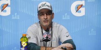 Frank Reich giving an interview during the Super Bowl LII Opening Night in 2018