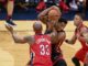 Heat's Hassan Whiteside grabs a rebound from Pelicans' forward Dante Cunningham