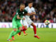 England's Jesse Lingard (right) in duel with Slovenia's Aljaz Struna