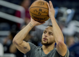 Golden State Warriors guard Stephen Curry at a Warriors vs Magic game in 2017