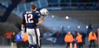 Quarterback Tom Brady comes off the field during the NFL game between the Detroit Lions and the New England Patriots in January 2022.