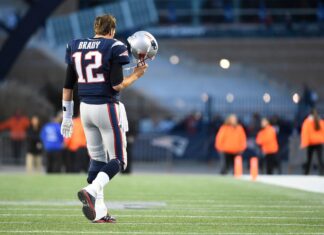 Quarterback Tom Brady comes off the field during the NFL game between the Detroit Lions and the New England Patriots in January 2022.