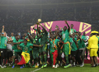 celebrates trophy win at the 2021 Africa Cup of Nations.