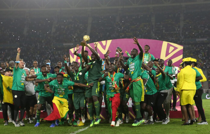 celebrates trophy win at the 2021 Africa Cup of Nations.