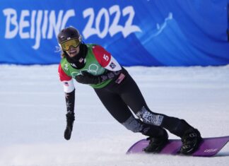 Lindsey Jacobellis celebrates in the finish area after winning her semi-final heat in the Women's Snowboard Cross finals at the 2022 Winter Olympics in Zhangjiakou, China on Wednesday, February 9, 2022.