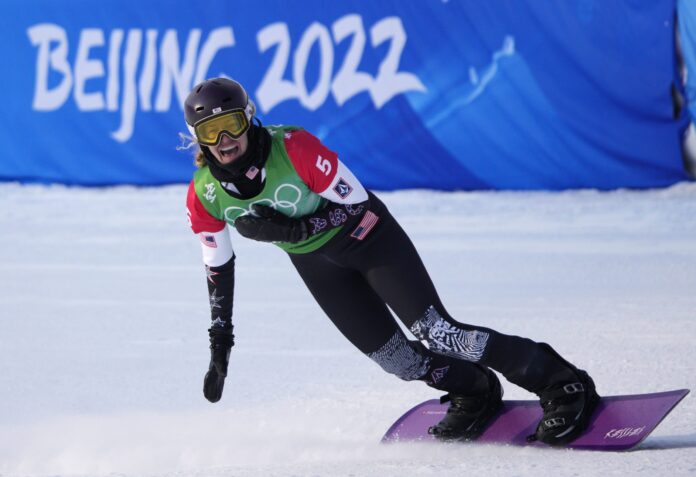 Lindsey Jacobellis celebrates in the finish area after winning her semi-final heat in the Women's Snowboard Cross finals at the 2022 Winter Olympics in Zhangjiakou, China on Wednesday, February 9, 2022.