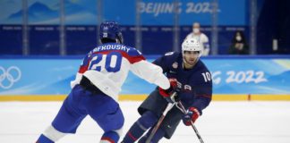 Team United States forward Matty Beniers (10) and Team Slovakia forward Juraj Slafkovsky (20) during the Beijing 2022 Olympic Winter Games