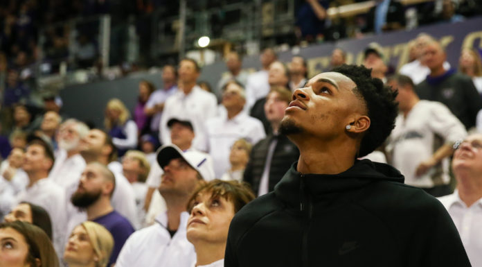 Dejounte Murray attending a college basketball game
