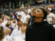 Dejounte Murray attending a college basketball game