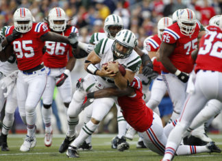 Patriots in red uniforms versus the New York Jets