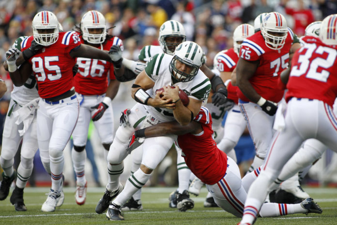 Patriots in red uniforms versus the New York Jets