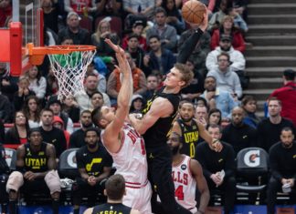 Lauri Markkanen (23 Utah Jazz) dunks the ball over Nikola Vucevic (9 Chicago Bulls) during the game between the Chicago Bulls and Utah Jazz in January 2023