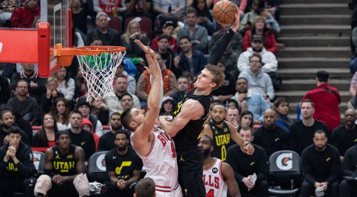 Lauri Markkanen (23 Utah Jazz) dunks the ball over Nikola Vucevic (9 Chicago Bulls) during the game between the Chicago Bulls and Utah Jazz in January 2023