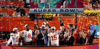 Kansas City Chiefs quarterback Patrick Mahomes lifts The Vince Lombardi Trophy at Super Bowl LVII in February 2023
