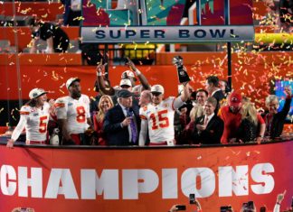 Kansas City Chiefs quarterback Patrick Mahomes lifts The Vince Lombardi Trophy at Super Bowl LVII in February 2023