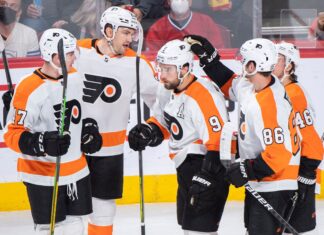 Philadelphia Flyers' Ivan Provorov (9) celebrates with teammates after scoring against the Montreal Canadiens in April 2022
