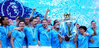 Ilkay Gundogan of Manchester City lifts the Premier League trophy in May 2023
