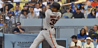 San Francisco Giants' LaMonte Wade Jr. hits a three-run home run in a Los Angeles Dodgers vs San Francisco Giants game in June 2023
