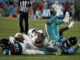 Dolphins Wide Receiver Daewood Davis is tackled by Jaguars in Florida, August 26, 2023.