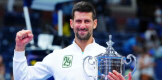 Novak Djokovic lifts the US Open trophy in September 2023