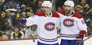 Montreal Canadiens' Denis Gurianov (25) and David Savard (58) in March 2023
