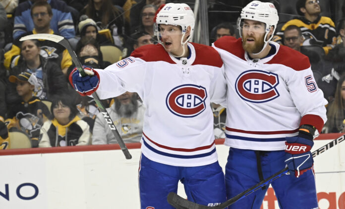 Montreal Canadiens' Denis Gurianov (25) and David Savard (58) in March 2023