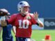 Mac Jones with the Patriots in July 2023