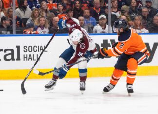Alex Newhook (18) with Colorado Avalanche and Edmonton Oilers' Duncan Keith (2) in 2022