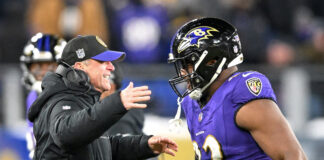 Baltimore Ravens head coach John Harbaugh and defensive tackle Justin Madubuike in January 2024