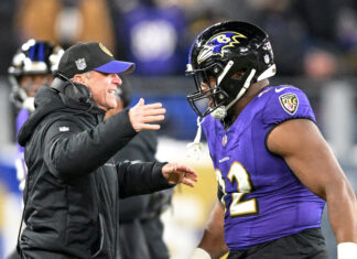 Baltimore Ravens head coach John Harbaugh and defensive tackle Justin Madubuike in January 2024