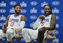 Los Angeles Clippers' guard/forward Paul George (L) and forward Montrezl Harrell participate in Clippers' media day in September 2019