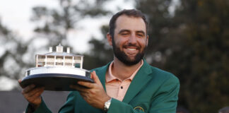Scottie Scheffler holds the Masters Trophy after winning the Masters tournament at Augusta National Golf Club in April 2024