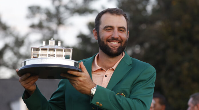 Scottie Scheffler holds the Masters Trophy after winning the Masters tournament at Augusta National Golf Club in April 2024