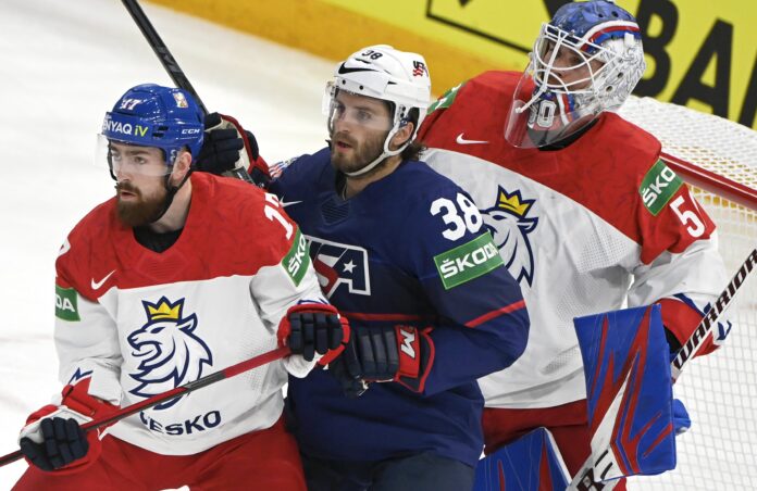Karel Vejmelka of Czech Republic, Filip Hronek (L) of Czech Republic and Ryan Hartman of the United States of America during the 2022 IIHF Ice Hockey World Championships preliminary round group B match in May 2022