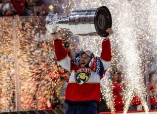 Florida Panthers center Aleksander Barkov lifts the Stanley Cup after defeating the Edmonton Oilers in June 2024