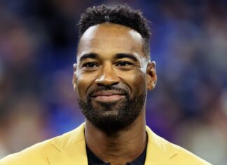 Former Detroit Lions wide receiver Calvin Johnson, Jr., "Megatron", is honored before receiving his Hall of Fame ring during a special halftime ceremony during an NFL football game between the Detroit Lions and the Baltimore Ravens in September 2021