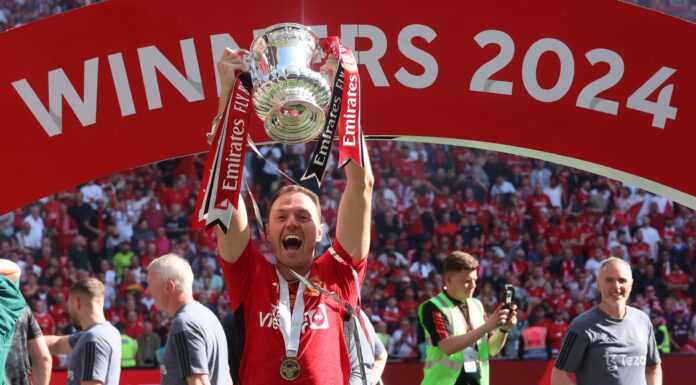 Manchester United Undergoes Mass Job Cuts By New Owners Jonny Evans lifting The FA Cup Trophy after The Emirates FA Cup Final soccer match between Manchester City and Manchester United in May 2024