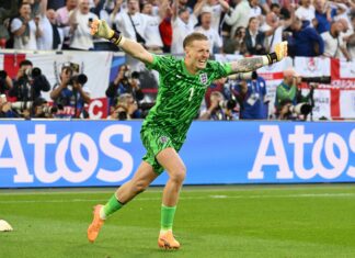 England goalkeeper Jordan Pickford celebrates victory during the UEFA EURO 2024 quarter-final match between England and Switzerland in July 2024