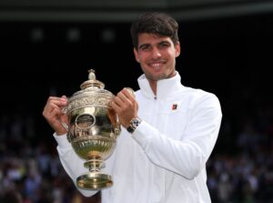 Carlos Alcaraz celebrates victory in the Gentlemen's Singles final Wimbledon Tennis Championships in July 2024