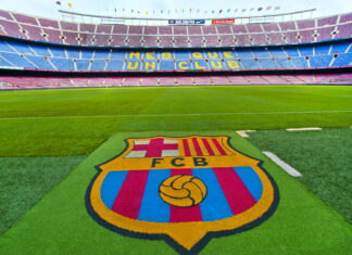 FC Barcelona emblem on the grass at Camp Nou stadium
