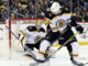Jeremy Swayman and Brandon Carlo (25) with the Boston Bruins in April 2023