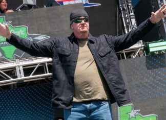 The Undertaker walks onstage during pre-race ceremonies prior to the NASCAR Cup Series Echopark Automotive Grand Prix in March 2022