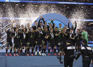 Mexico midfielder EDSON Ã?LVAREZ lifts the CONCACAF Nations League championship trophy after the 2025 CONCACAF Nations League final in March 2025